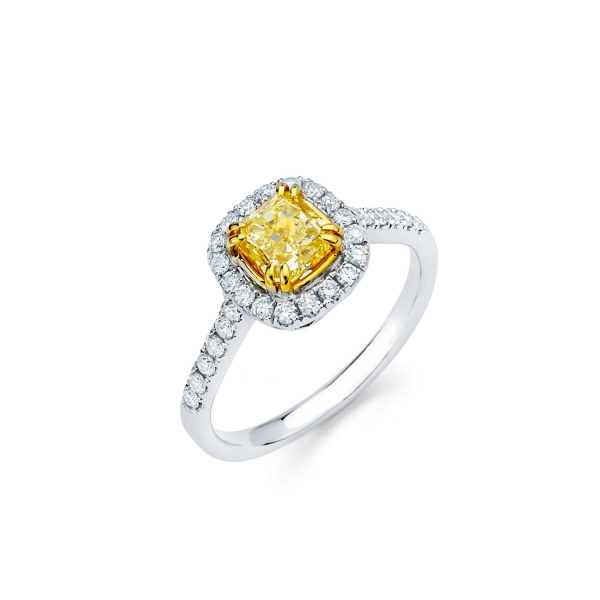 Halo style engagement ring with fancy yellow diamond