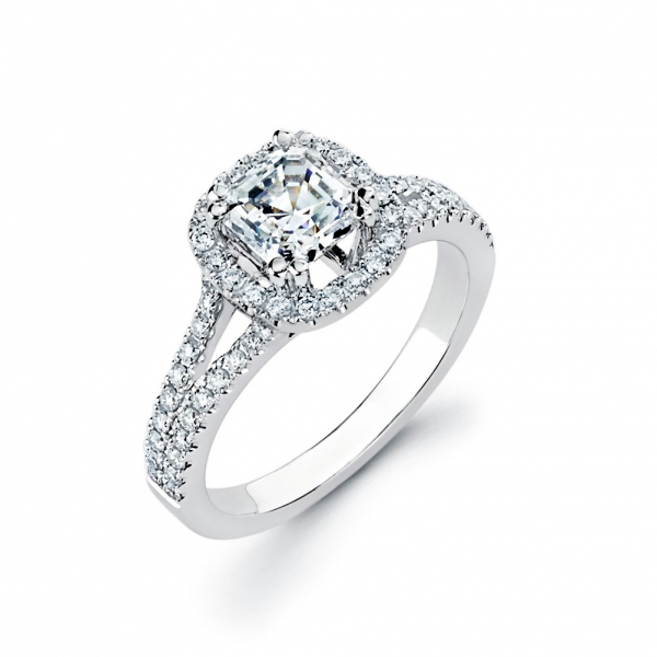 Halo style diamond engagement ring in white gold