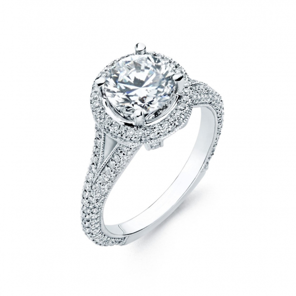 Halo style diamond engagement ring in white gold