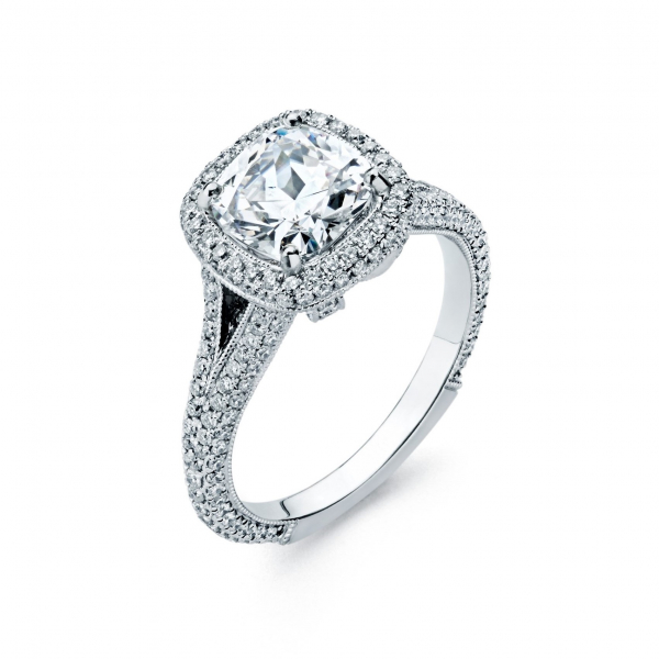 Halo style diamond engagement ring in white gold