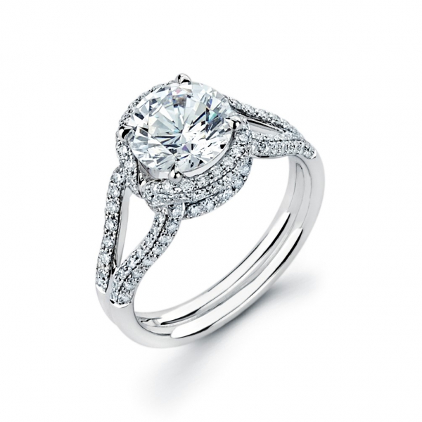 Halo style diamond engagement ring in white gold