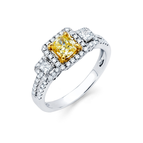 Three stone diamond engagement ring featuring fancy yellow diamond