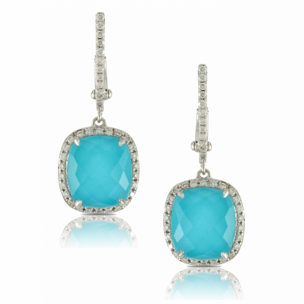 Lady's 18 karat white gold drop earrings featuring sleeping beauty turquoise surrounded by a diamond halo