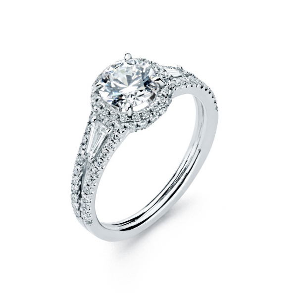 Halo style diamond engagement ring in white gold